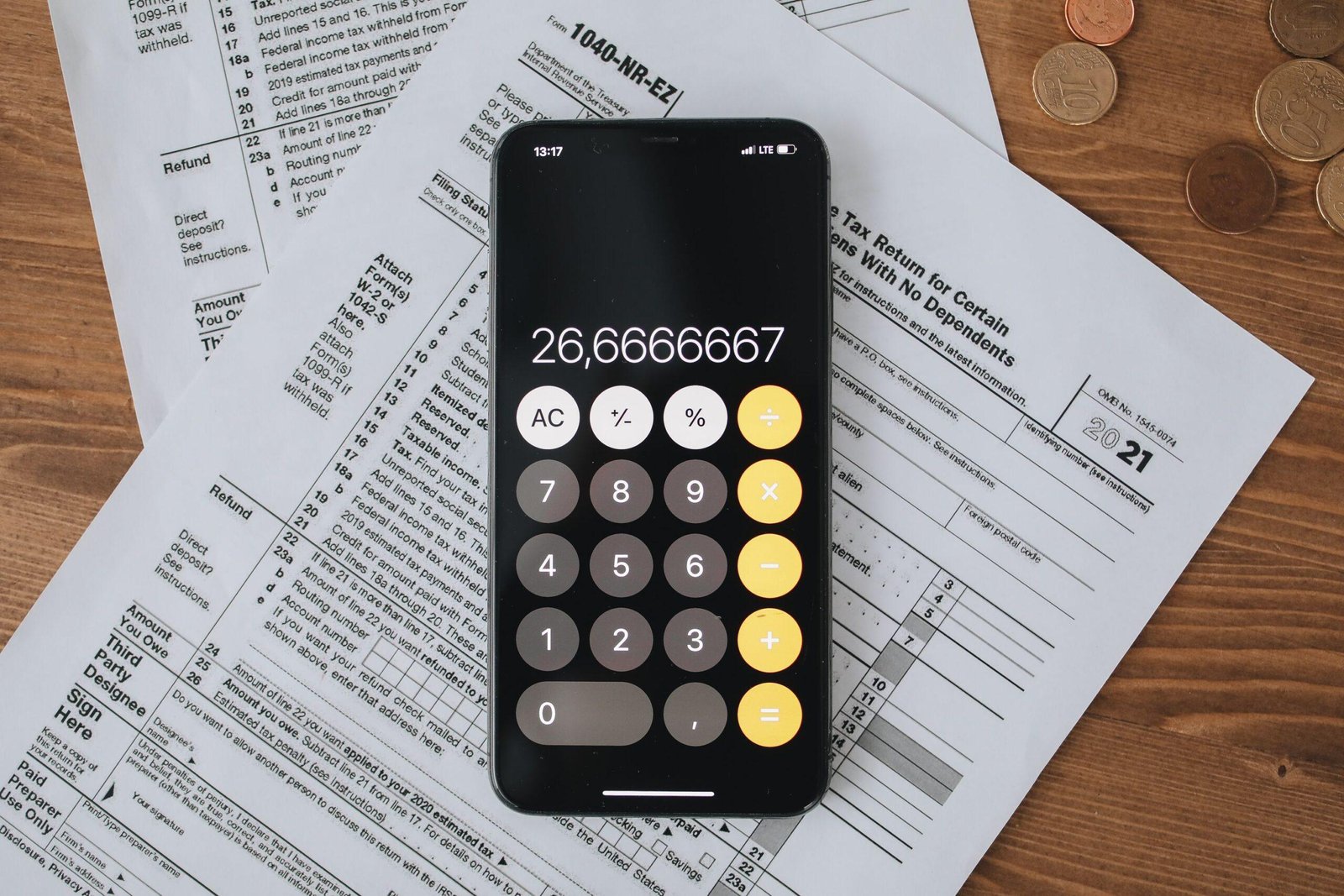 Tax forms with a calculator — 2026 small business tax and 1099 reporting changes