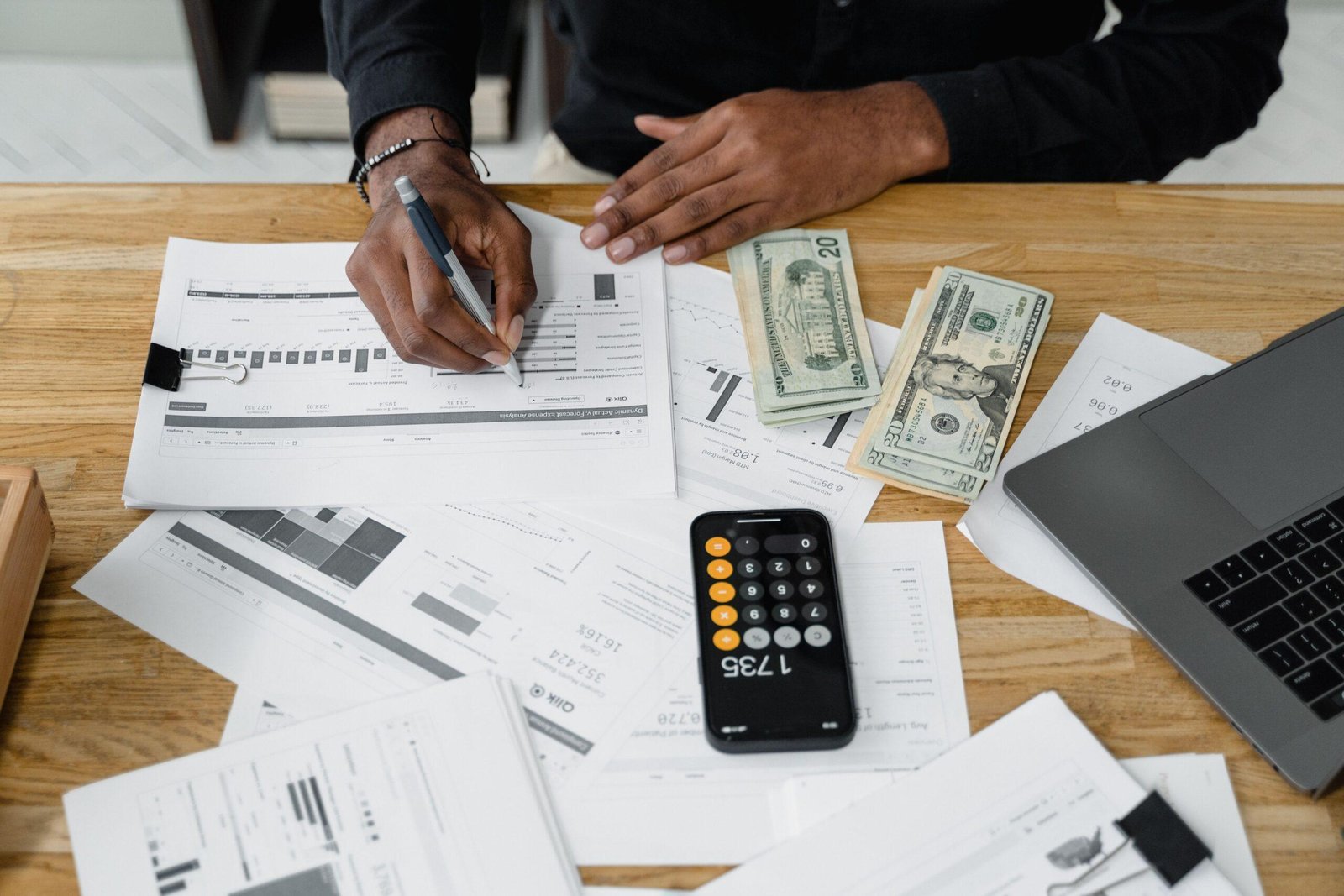 Accountant's desk with tax documents and calculator — planning for 2026 small business tax changes