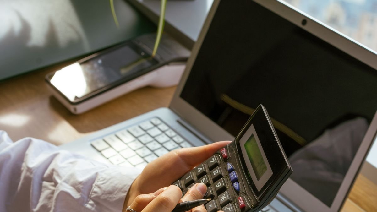US SaaS sales tax guide - laptop and calculator representing software tax compliance